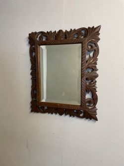 C19TH MIRROR IN A CARVED OAK FRAME