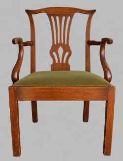 A GEORGIAN MAHOGANY CHIPPENDALE STYLE ELBOW DESK CHAIR