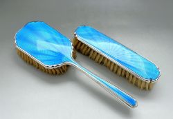 A PAIR OF ART DECO SILVER GUILLOCHE ENAMEL BRUSHES