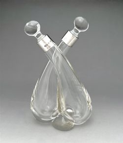 A GEORGE V SILVER MOUNTED OIL VINEGAR DUO