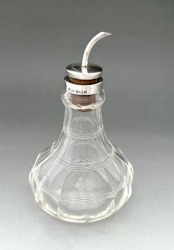 A STYLISH ART DECO SILVER MOUNTED BITTERS JIGGER