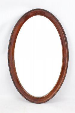 EDWARDIAN WALNUT FRAMED OVAL MIRROR