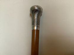 A VERY SUBSTANTIAL MILITARY WALKING CANE