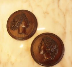 A PAIR OF 19TH C CARVED MAHOGANY PLAQUES