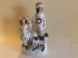 STAFFORDSHIRE GIRL AND BOY WITH WREATH AND DOG