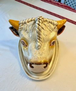 AN UNUSUAL 19TH CENTURY STAFFORDSHIRE COW HEAD CHEESE DISH