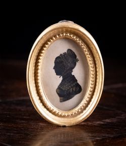 EARLY 19TH CENTURY GILDED SILHOUETTE PORTRAIT OF A LADY