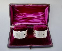 UNUSUAL CASED PAIR OF VICTORIAN SILVER PLATED NOVELTY BELT NAPKIN RINGS CIRCA 1890