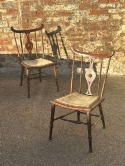 A PAIR OF ART FURNITURE MAHOGANY SIDE CHAIRS IN THE MANNER OF AND QUITE POSSIBLY BY THE FIRM J S HENRY LONDON AND GLASGOW C1895