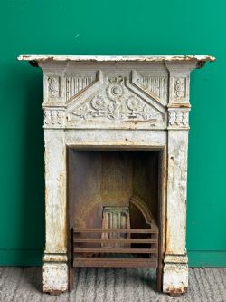 A VICTORIAN AESTHETIC MOVEMENT CAST IRON BEDROOM FIRE GRATE C1880'S