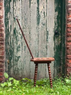 A WONDERFULLY ECCENTRIC ARTS AND CRAFTS CARVED ELM AND OAK SPINNING STOOL C1900