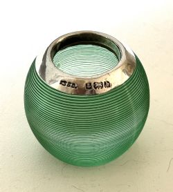 A RARE EDWARDIAN SILVER EMERALD GREEN GLASS MATCH STRIKER