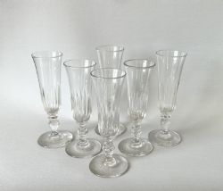 A MATCHED SET OF LATE VICTORIAN GUT GLASS CHAMPAGNE FLUTES