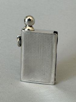 A RARE ART DECO NOVELTY SILVER 'BOOK' CIGAR LIGHTER