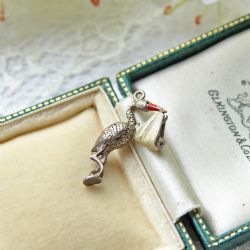VINTAGE STERLING SILVER STORK WITH BABY CHARM