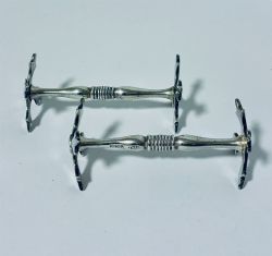 PAIR OF ANTIQUE SILVER KNIFE RESTS