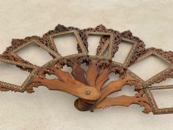 AN UNUSUAL ANTIQUE TREEN FAN WITH SEVEN PHOTO FRAMES