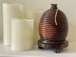 AN ANTIQUE TREEN BEE HIVE STRING BOX WITH CUTTER