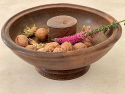 AN ANTIQUE TREEN NUT BOWL