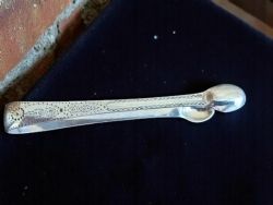 A PAIR OF GEORGE 111 SOLID SILVER ENGRAVED SUGAR TONGS