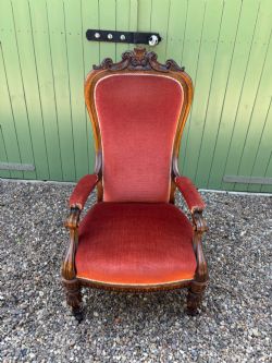 A VICTORIAN OAK OPEN ARM ARMCHAIR