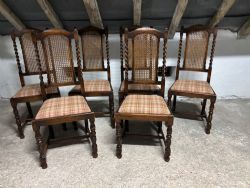A SET OF SIX 17THC STYLE OAK CANED BACK DINING CHAIRS