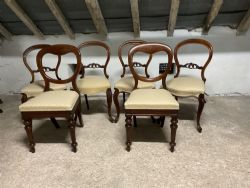 A SET OF FOUR WALNUT BALLOON BACK AND A PAIR OF MAHOGANY BALLOON BACK DINING CHAIRS