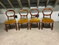 A SET OF FOUR VICTORIAN MAHOGANY BALLOON BACK DINING CHAIRS
