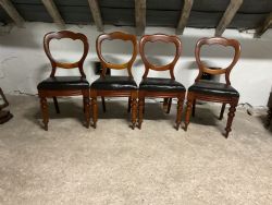 A SET OF FOUR VICTORIAN BALLOON BACK DINING CHAIRS