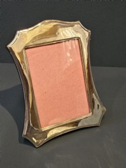 EDWARDIAN SILVER PHOTO FRAME WITH SWEPT SIDES