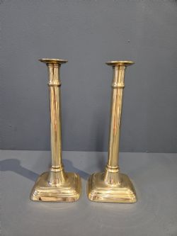 PAIR OF TALL GEORGE III SEEMED BRASS CANDLESTICKS