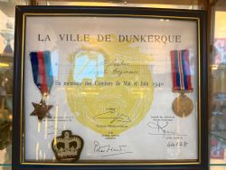 LA VILLE DE DUNKERQUE VETERANS ASSOCIATION MEDAL AND CITATION ALONG WITH TWO MEDALS AND 3 BADGES